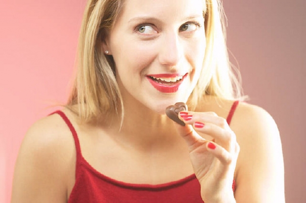 woman-eating-chocolate-heart